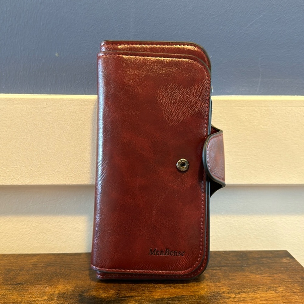 Solid Menbense burgundy leather men or woman’s wallet.